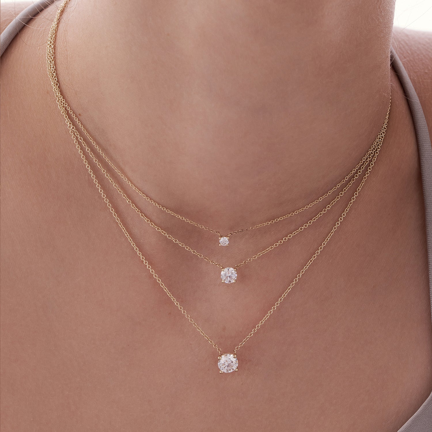 Classic gold necklace set with a lab-grown diamond weighing 50 points, half a carat