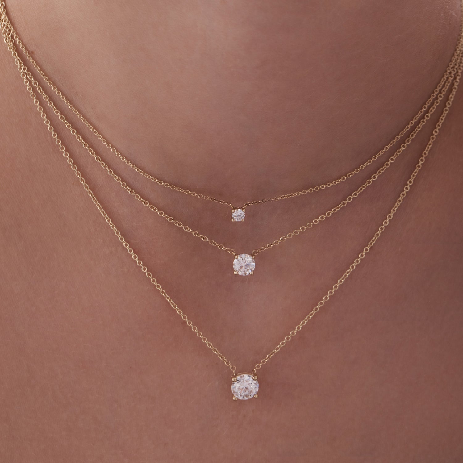 Classic gold necklace set with a lab-grown diamond weighing 50 points, half a carat