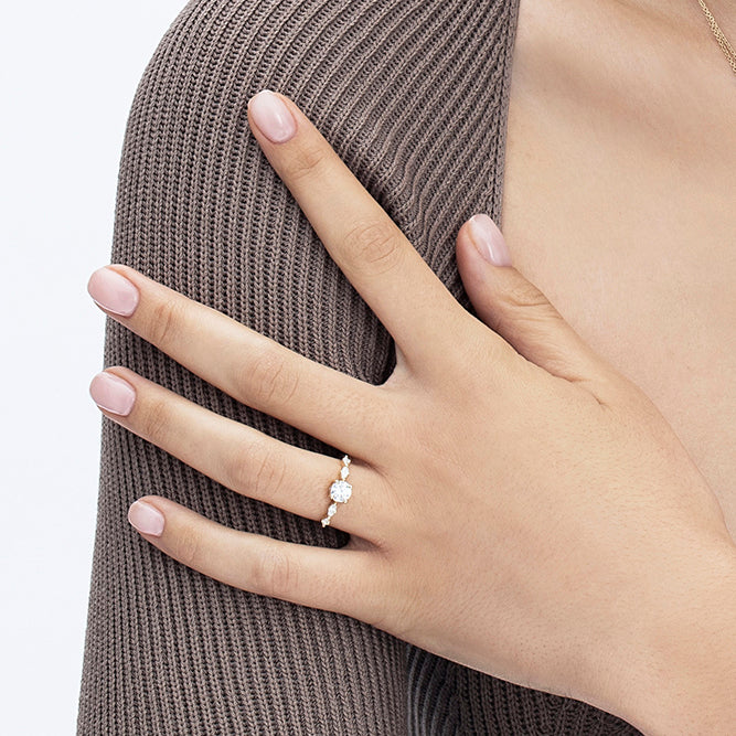 Engagement ring set with a 0.60 carat center round lab-grown diamond and marquise lab-grown diamonds