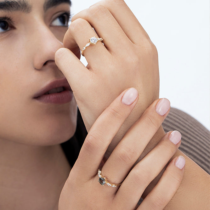 Engagement ring set with a 0.60 carat center round lab-grown diamond and marquise lab-grown diamonds