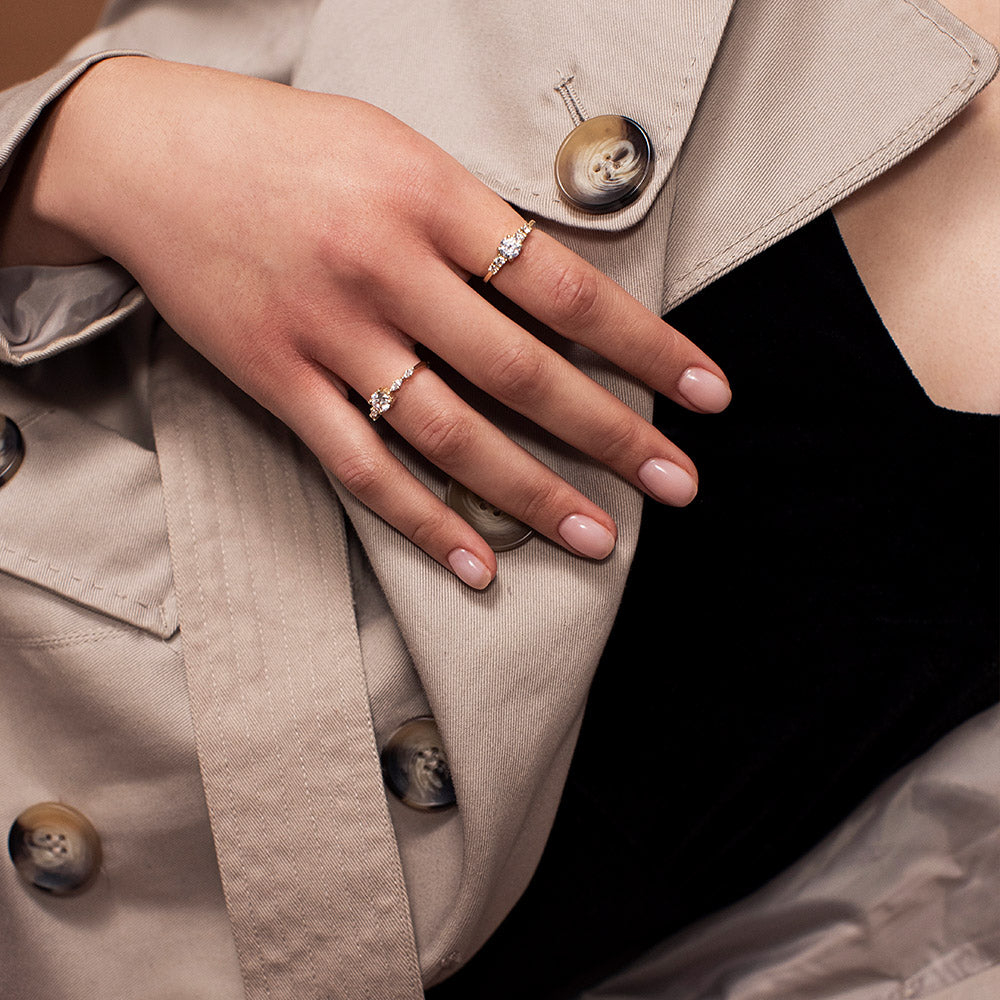 Engagement ring set with a 0.60 carat center round lab-grown diamond and marquise lab-grown diamonds