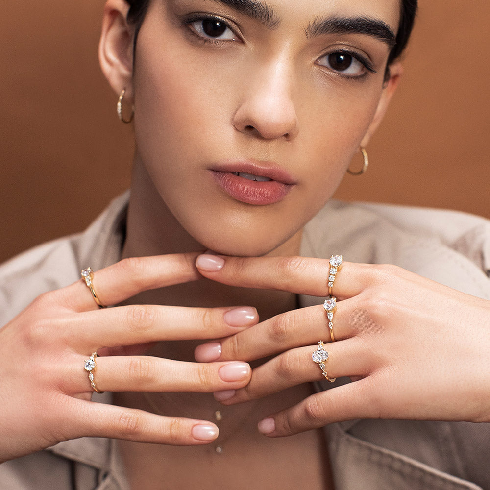 Engagement ring set with a 0.60 carat center round lab-grown diamond and marquise lab-grown diamonds