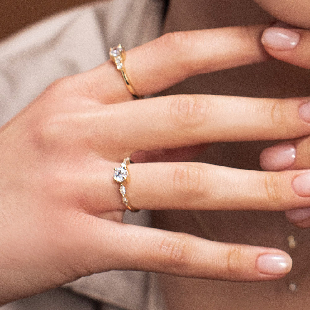 Engagement ring set with a 0.60 carat center round lab-grown diamond and marquise lab-grown diamonds