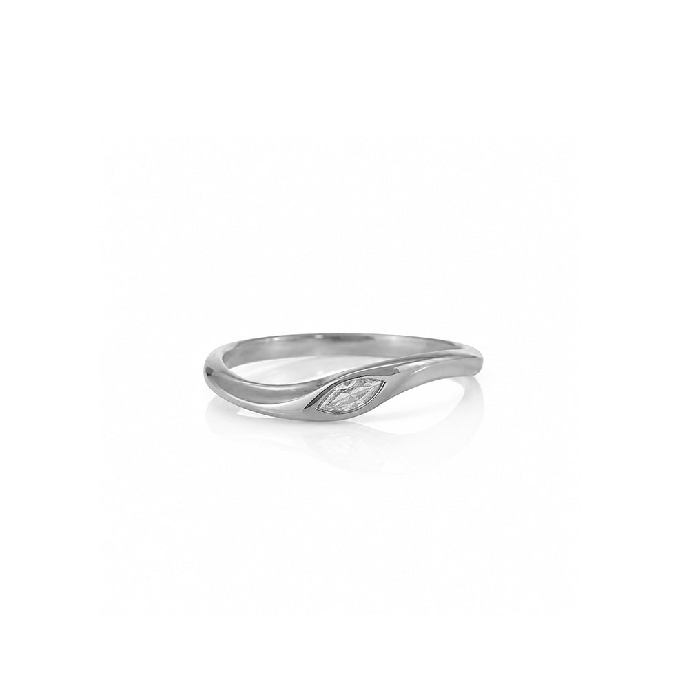 A delicate gold ring set with a marquise-cut lab-grown diamond