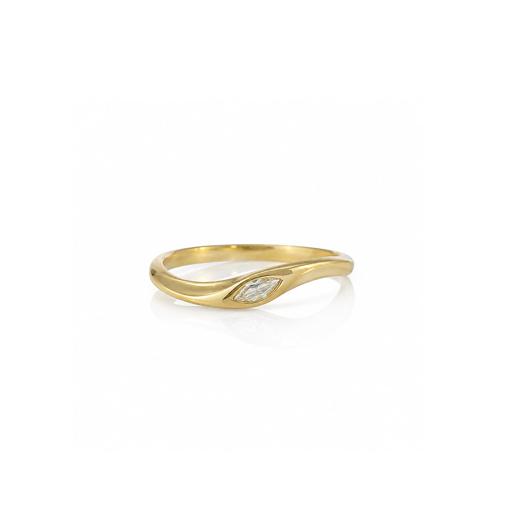A delicate gold ring set with a marquise-cut lab-grown diamond