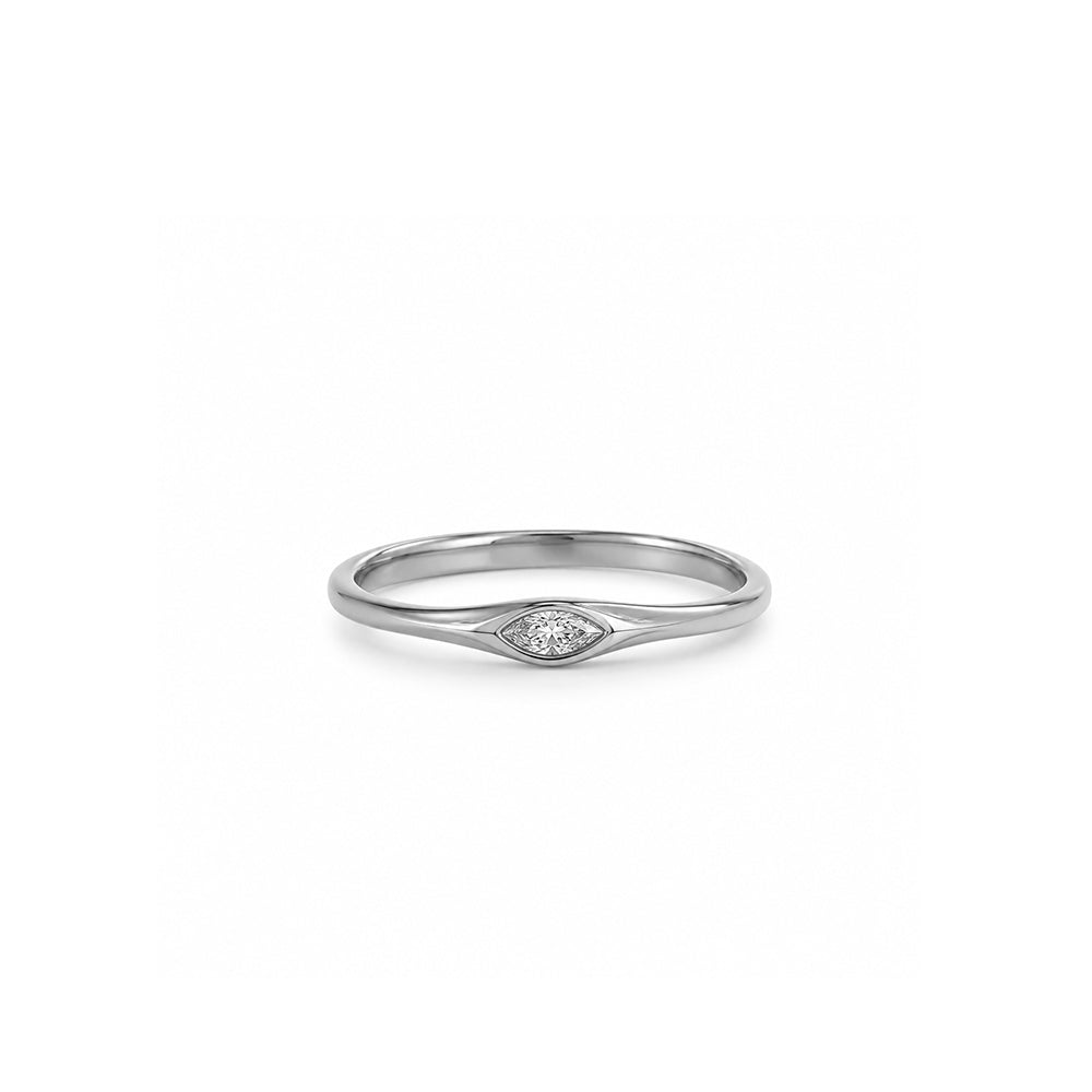 A delicate gold ring set with a marquise-cut lab-grown diamond
