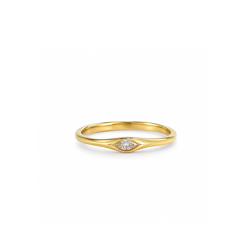 A delicate gold ring set with a marquise-cut lab-grown diamond