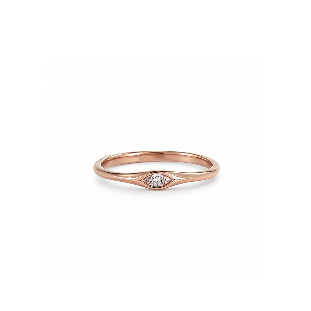 A delicate gold ring set with a marquise-cut lab-grown diamond