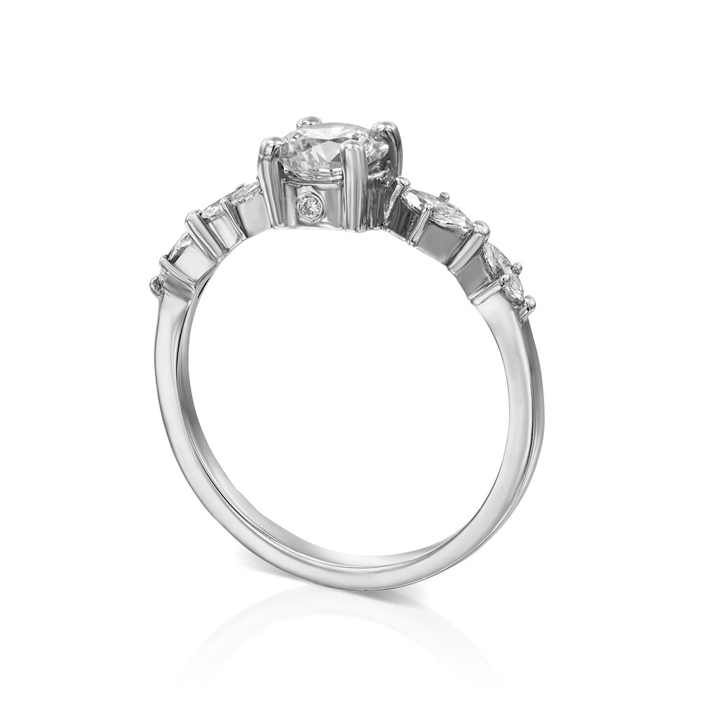 Engagement ring set with a 0.60 carat center round lab-grown diamond and marquise lab-grown diamonds