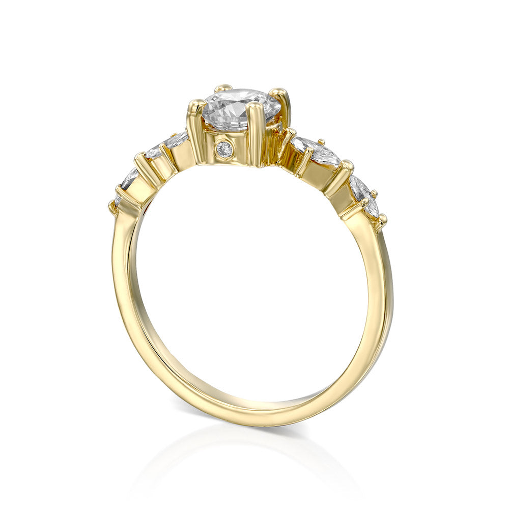 Engagement ring set with a 0.60 carat center round lab-grown diamond and marquise lab-grown diamonds